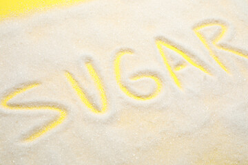 Composition with word SUGAR on yellow background