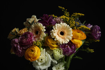 Beautiful fresh flowers on dark background, closeup