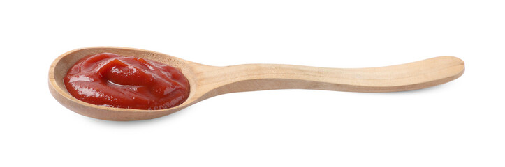 Ketchup in wooden spoon isolated on white