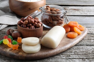 Marzipan and other ingredients for homemade Stollen on wooden table. Baking traditional German Christmas bread