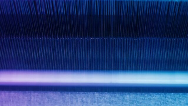 Weaving loom industrial textile production at work. close up. 4K . 4