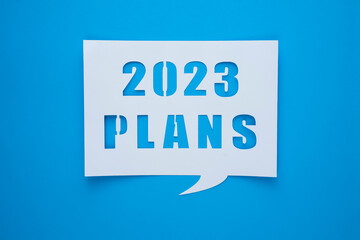 2023 plans text design with letter cutouts . Concept of business plans and goals and strategies