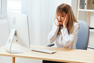 Shocked upset adorable blonde businesswoman worker touch chin both hands thinking of problem...