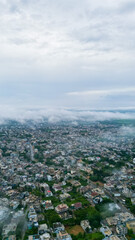 Aerial view weather clouds on city, mountains, drone shot, clouds on mirpur azad kashmir, Pakistani or Indian or South Asian drone photography
