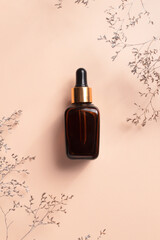 Fototapeta premium Cosmetic bottle with dropper pipette with serum. Skin care cosmetic. Beauty concept for face body care