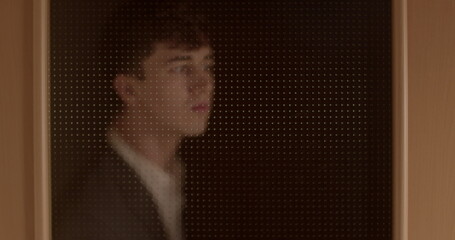Man peeking through the door, attraction. Spy in a suit, person who secretly collects and reports...
