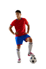 Portrait of proud young man, football player in uniform posing with ball isolated over white studio background © Lustre Art Group 