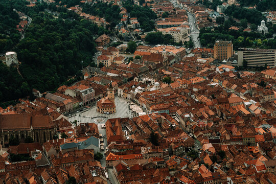 Scenic cityscape with red roofed buildings and square
