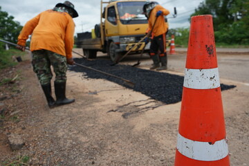The image is blurred in the construction of asphalt road.