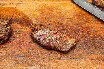 delicious steak on barbecue cutting board