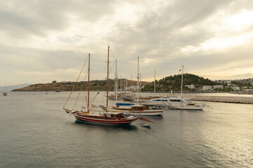 Boats, sea and mountain. Beatiful landscape at Bodrum, Turkey with cloudy sky.