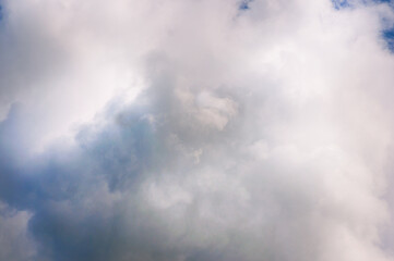 blue sky with clouds White cumulus clouds in the blue sky. Sky background. Large cloudiness. Midsummer.