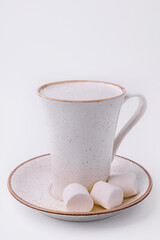 cup of hot cocoa with marshmallows isolated on white background