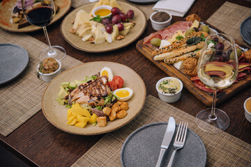 Italian appetizer - various types of ham, cheese and grissini