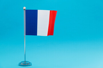 French table flag waving on blue background