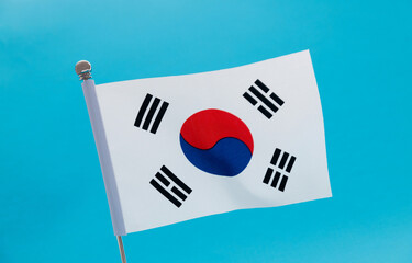 South Korean flag waving on blue background