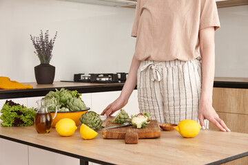 Woman in the kitchen preparing to cook