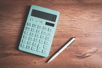 Close up calculator and financial report - accounting concept