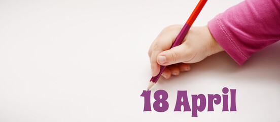 A child's hand writes 18 april in a lilac pencil. Banner with copy space