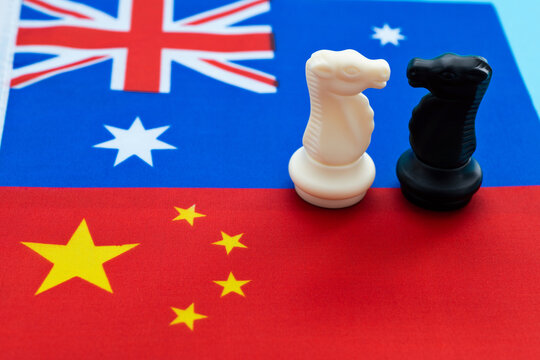 Two knights standing on Chinese flag and Australian flag