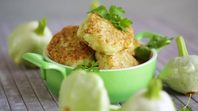 vegetable fried squash and zucchini cutlets in a ceramic form