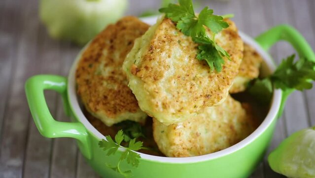 vegetable fried squash and zucchini cutlets in a ceramic form