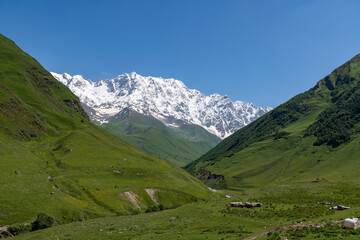 Shkhara mountains, the highest point in the nation of Georgia It is located near the Russian-Georgian border, in Russia's Kabardino-Balkaria region. Beautiful snow covered mountains.
