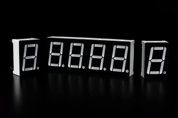 Seven segment indicators on a black background. Background picture. Arduino project concept.