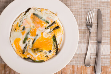 Scrambled eggs with asparagus for breakfast