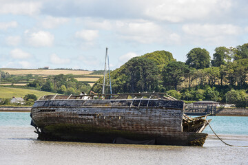 An old ship wreck site in low water after being abandoned