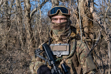 Fototapeta premium Male modern soldier in the autumn forest 