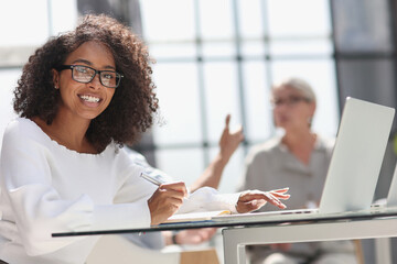 young attractive african american woman in the office