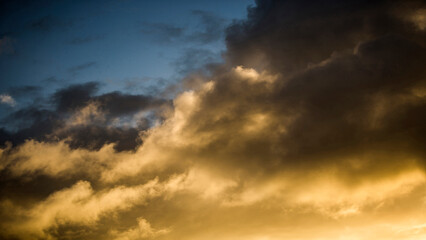 Naklejka na ściany i meble Dramatic sky with clouds at sunset
