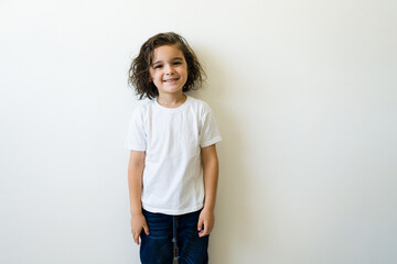 Happy elementary boy with a casual mockup t-shirt