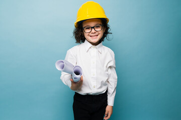 Smiling elementary boy aspiring engineer