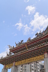 Taipei - July 17, 2022: Shot of the entrance of Longshan Temple in Taipei on a sunny day.
