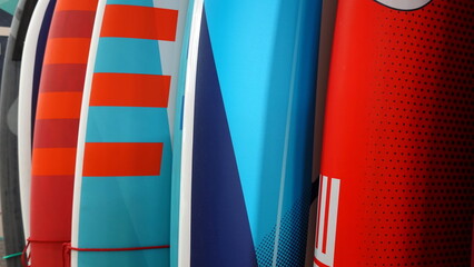 Surfboards stand in a row. Close Up View