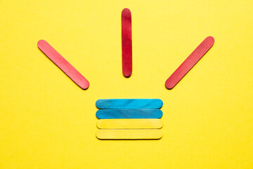 Flag of ukraine made of wooden colored sticks. Red sticks are symbols of attention. Attention to Ukraine.