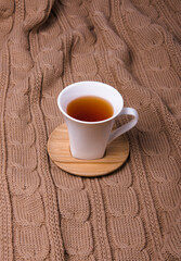 White ceramic mug with tea