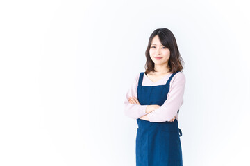 エプロンを着た笑顔の主婦