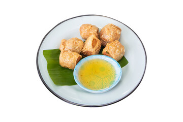 Hoi jo crab rolls or crab jujube placed on a green banana leaf in a tiled dish isolated on cut out PNG or transparent background.. Thai people called Hoi-cho local traditional style.
