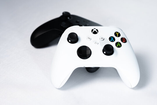 Ivano-Frankivsk, Ukraine August 14, 2022: Gamepad Microsoft Xbox Wireless Controller, two controllers black and white on a white background.
