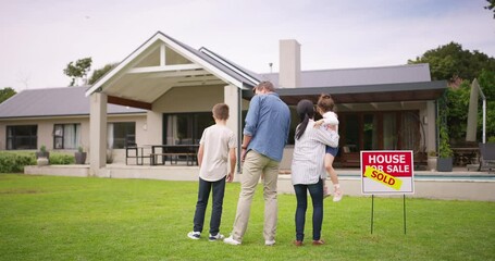Family ready to move into a new home, real estate house purchase. Financial investment and freedom to own property as adults. Young parents excited, looking at sold home from the garden