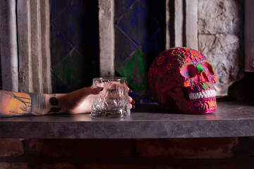 A painted skull and a glass