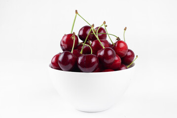Fototapeta na wymiar Sweet cherry. Cherries in a bowl. On a white background.