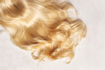 Fototapeta premium Beautiful healthy wavy long hair on white background