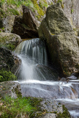 cascade on a mountain stream - water in motion - long exposure