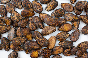 Dried watermelon seeds on a white background macro top view.