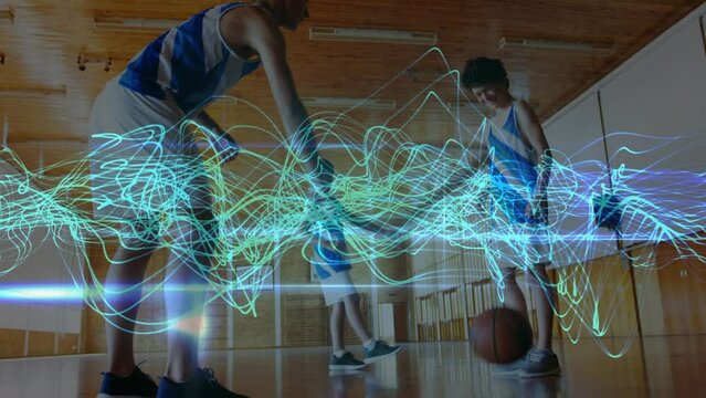 Animation of wavy lines over diverse teenage basketball team training