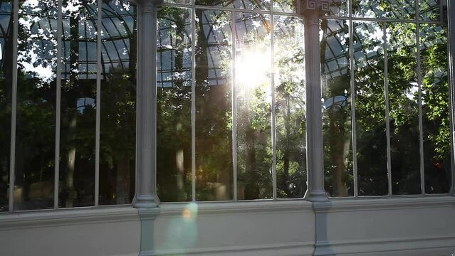 sun entering through glass of the glass palace in madrid